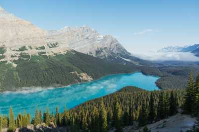 Crystal blue water meets an iconic mountain range.