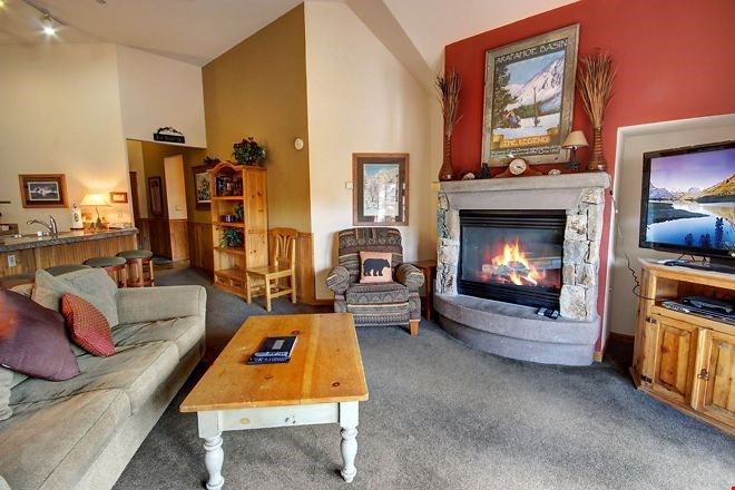 image Unwind after a day on the hill in front of the toasty natural stone fireplace