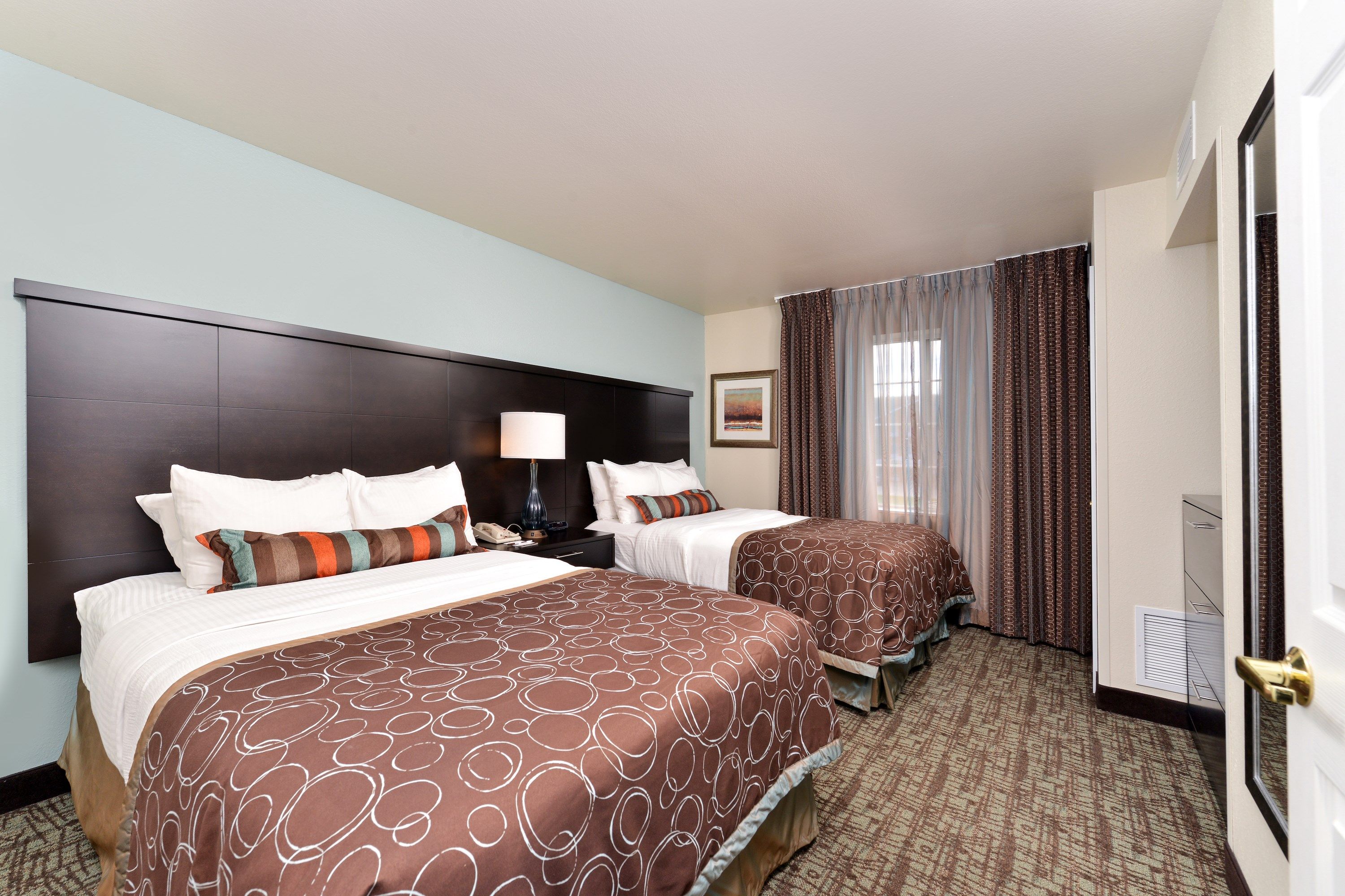 image Drift to sleep in a comfortable bed after a busy day.