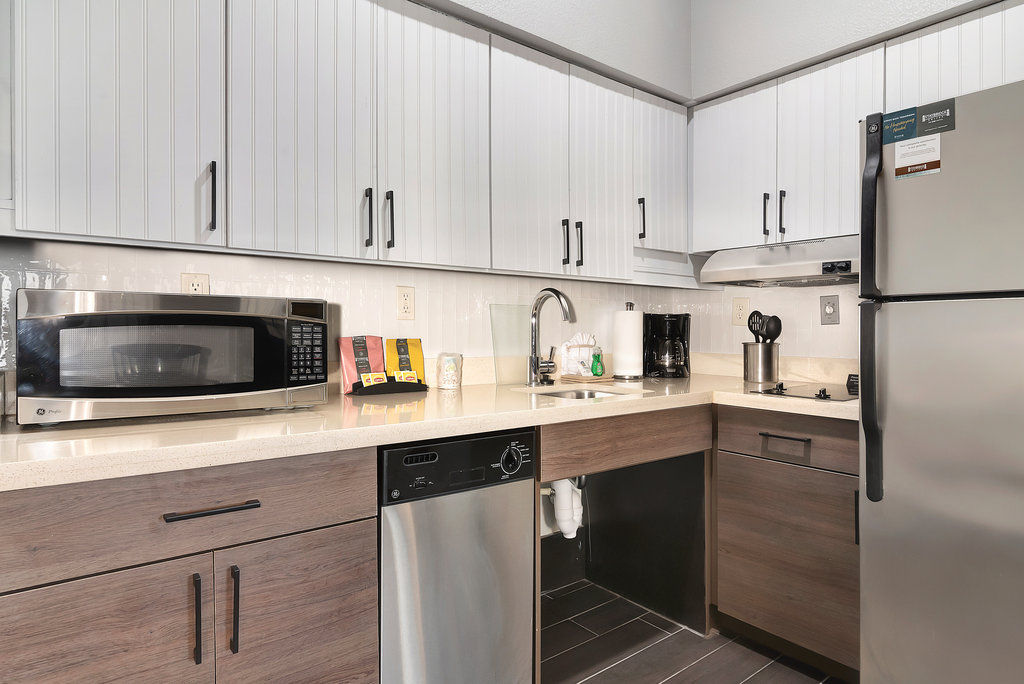 image Whip up your favorite meals with modern appliances and ample counter space in this fully-equipped kitchen.