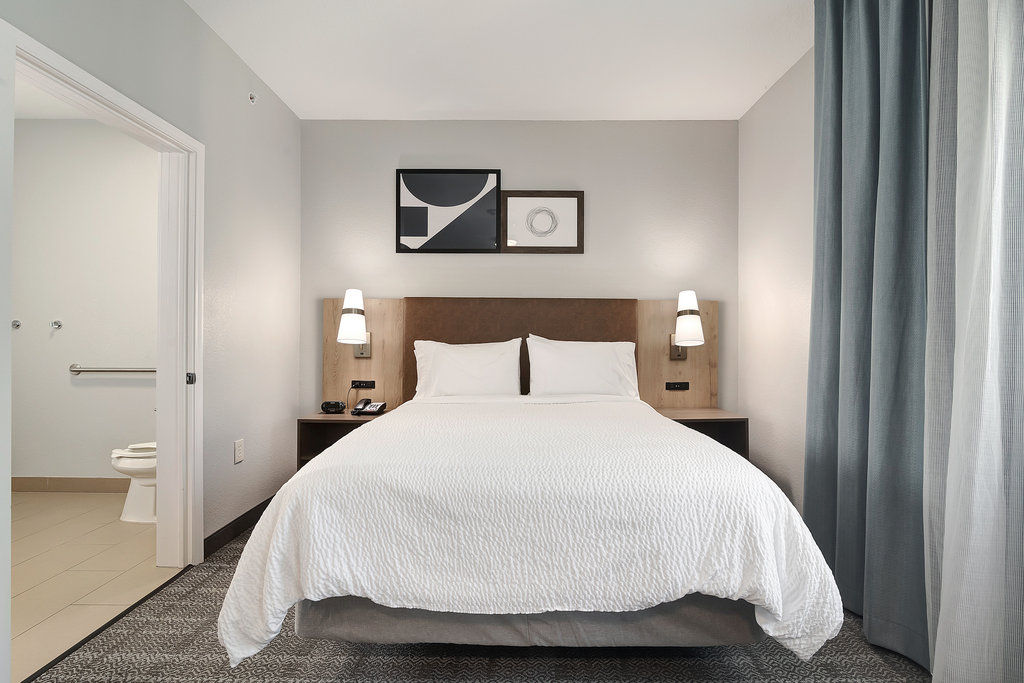 image Sleep soundly in a well-appointed bedroom featuring soft bedding and modern decor for your comfort.