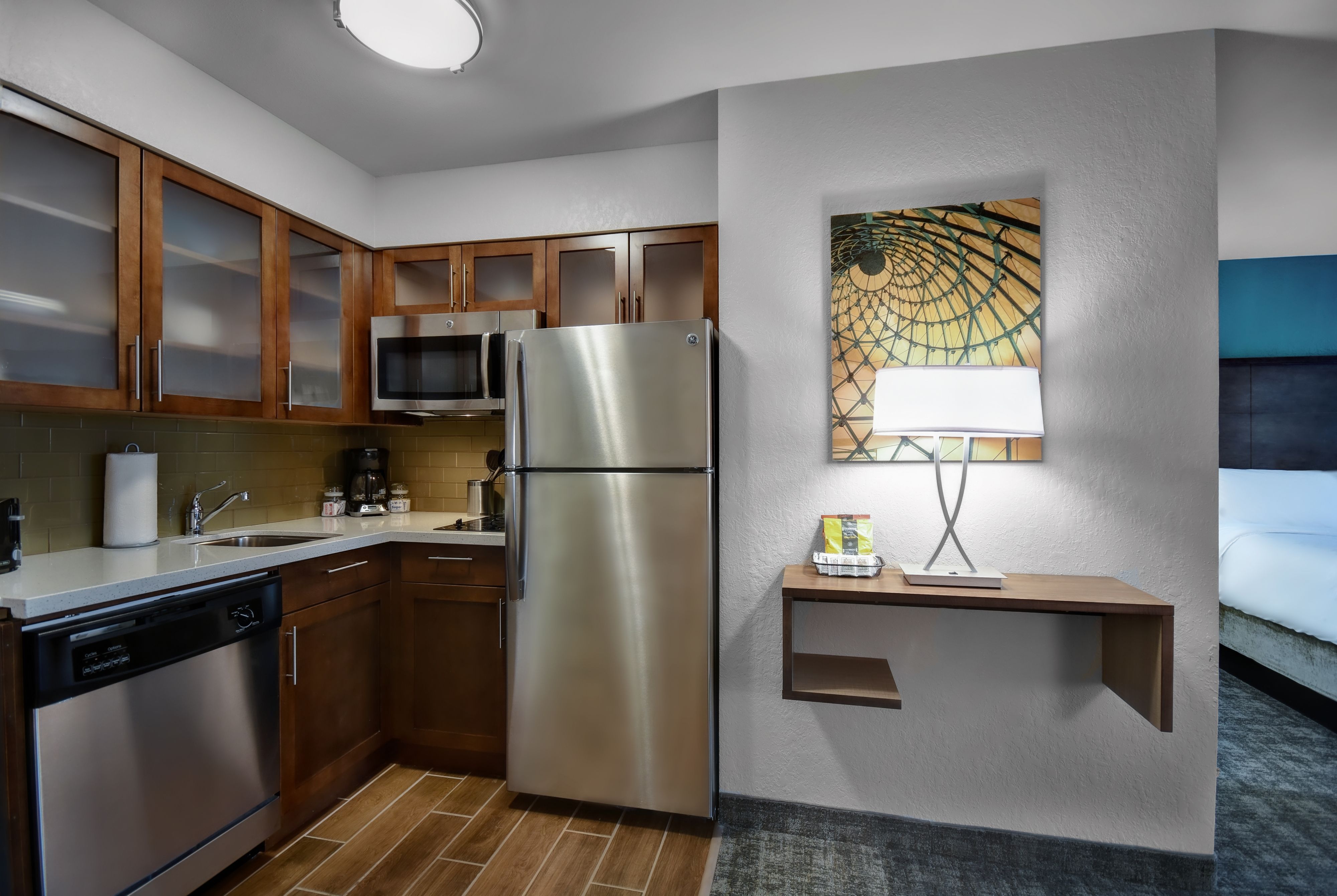 image Full kitchen with fridge, stovetop, microwave, and dishwasher — everything you need to cook in.