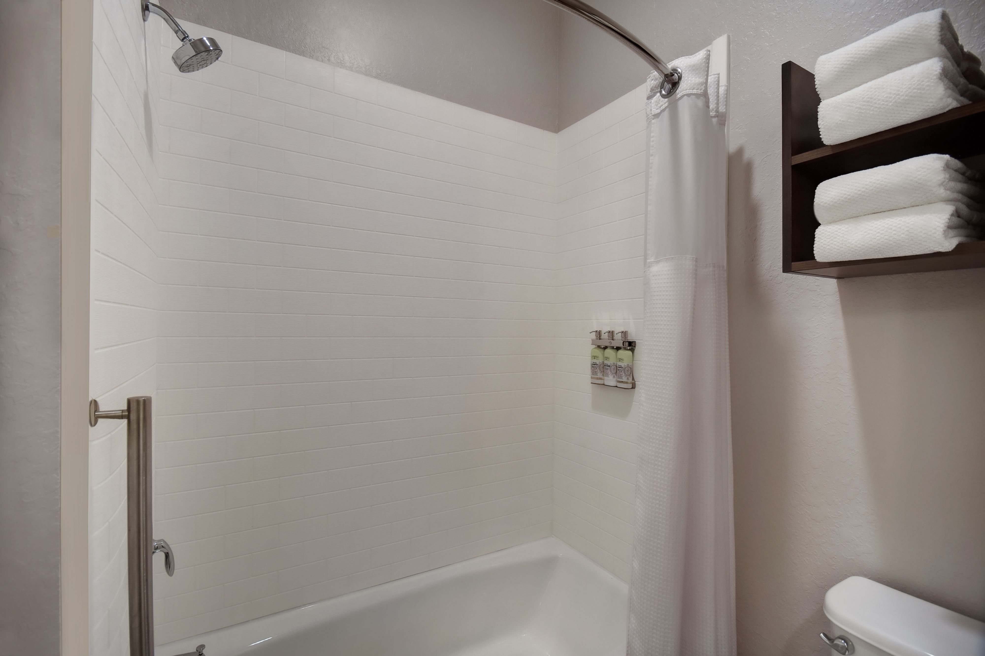 image Accessible bathtub with grab bars — ready for a safe, comfortable soak.