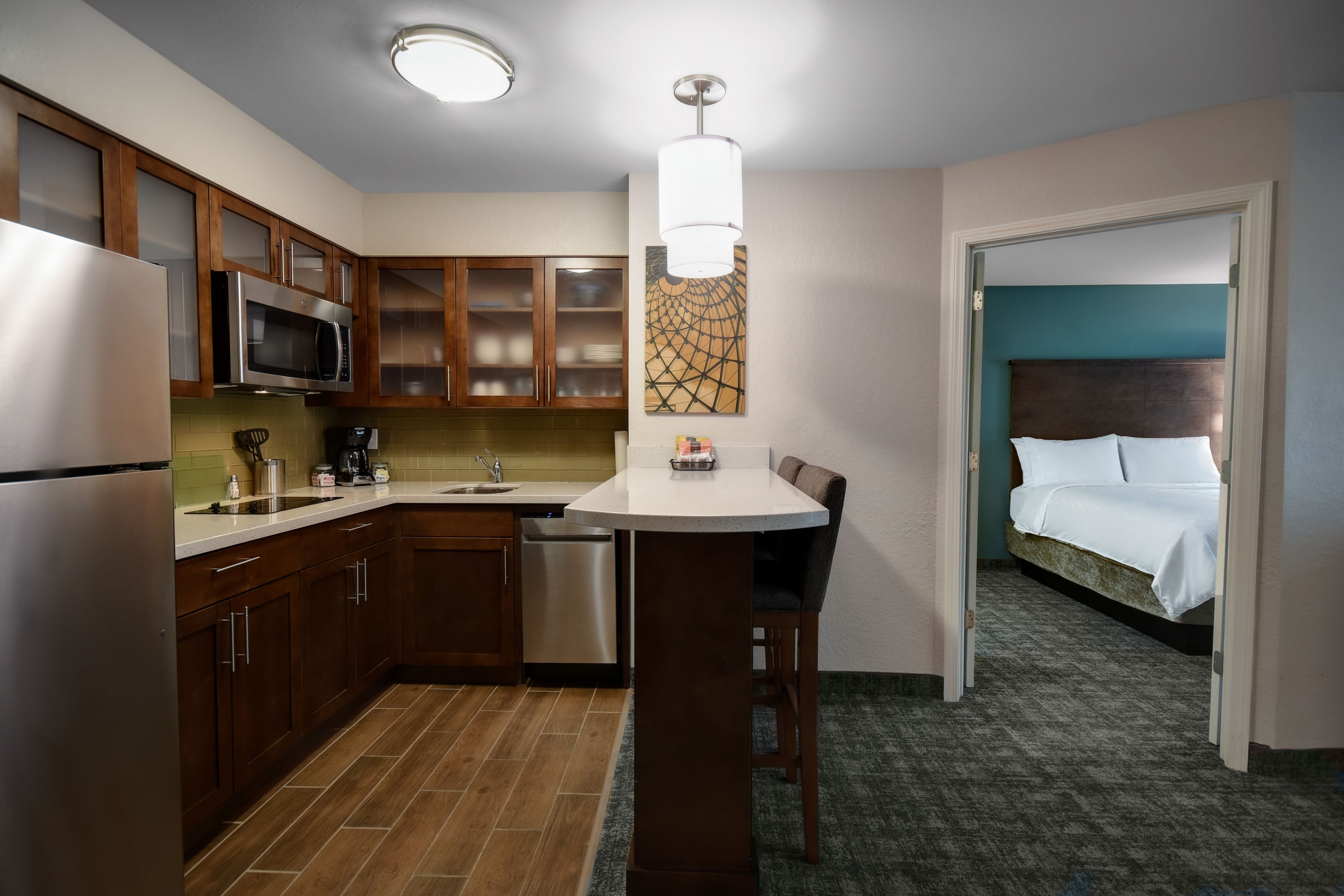image Full kitchen with stainless appliances, stovetop, dishwasher, and fridge — built for extended stays.