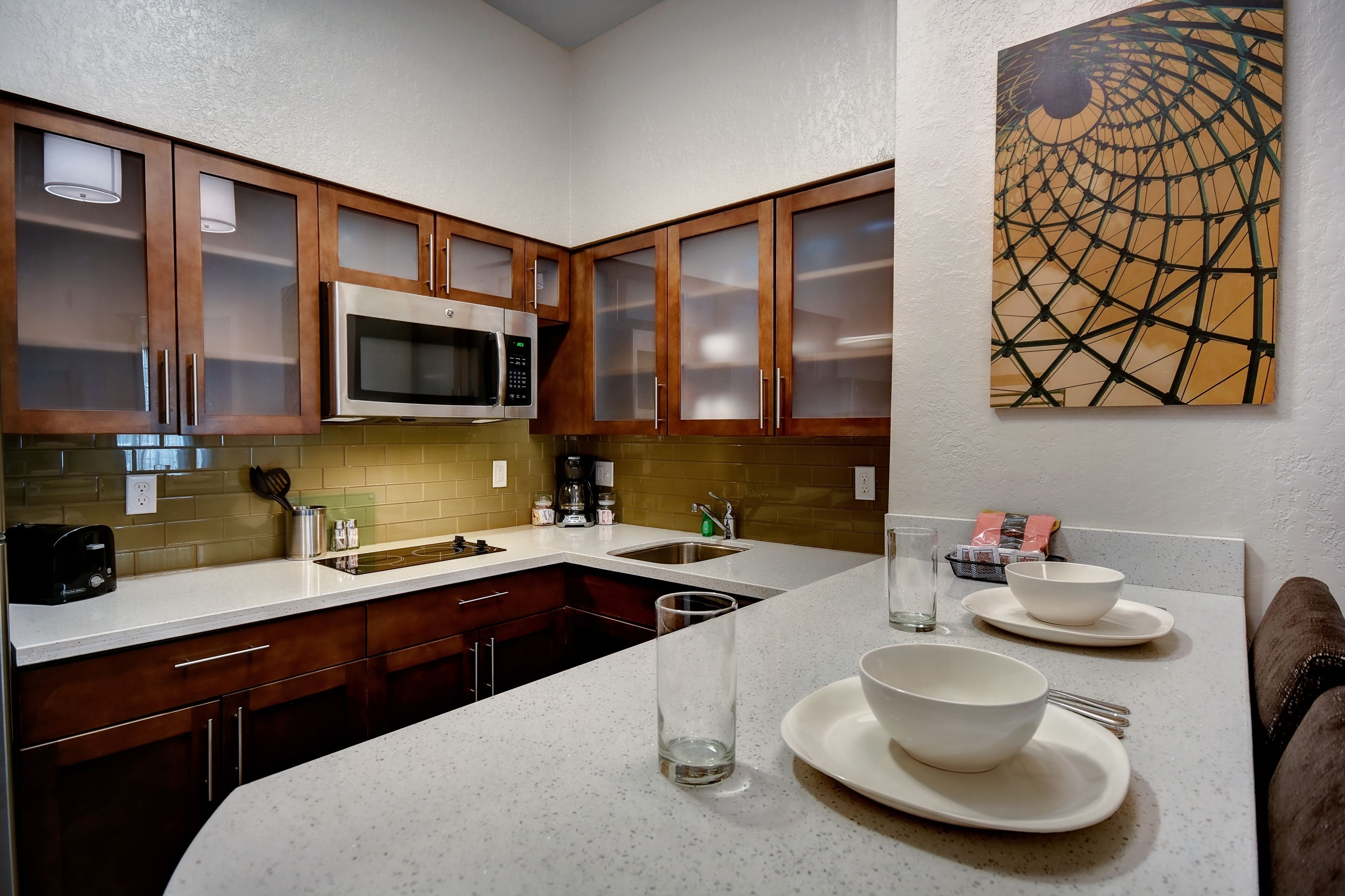 image Full kitchen with fridge, stovetop, dishwasher, microwave, toaster, and all cooking basics included.