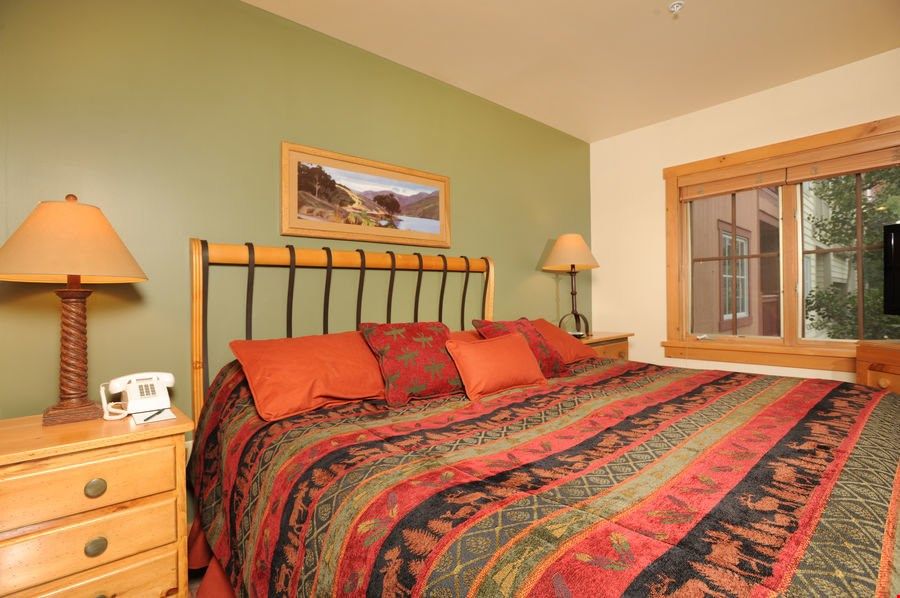 image The master bedroom features a comfortable bed. Bedding configurations vary.