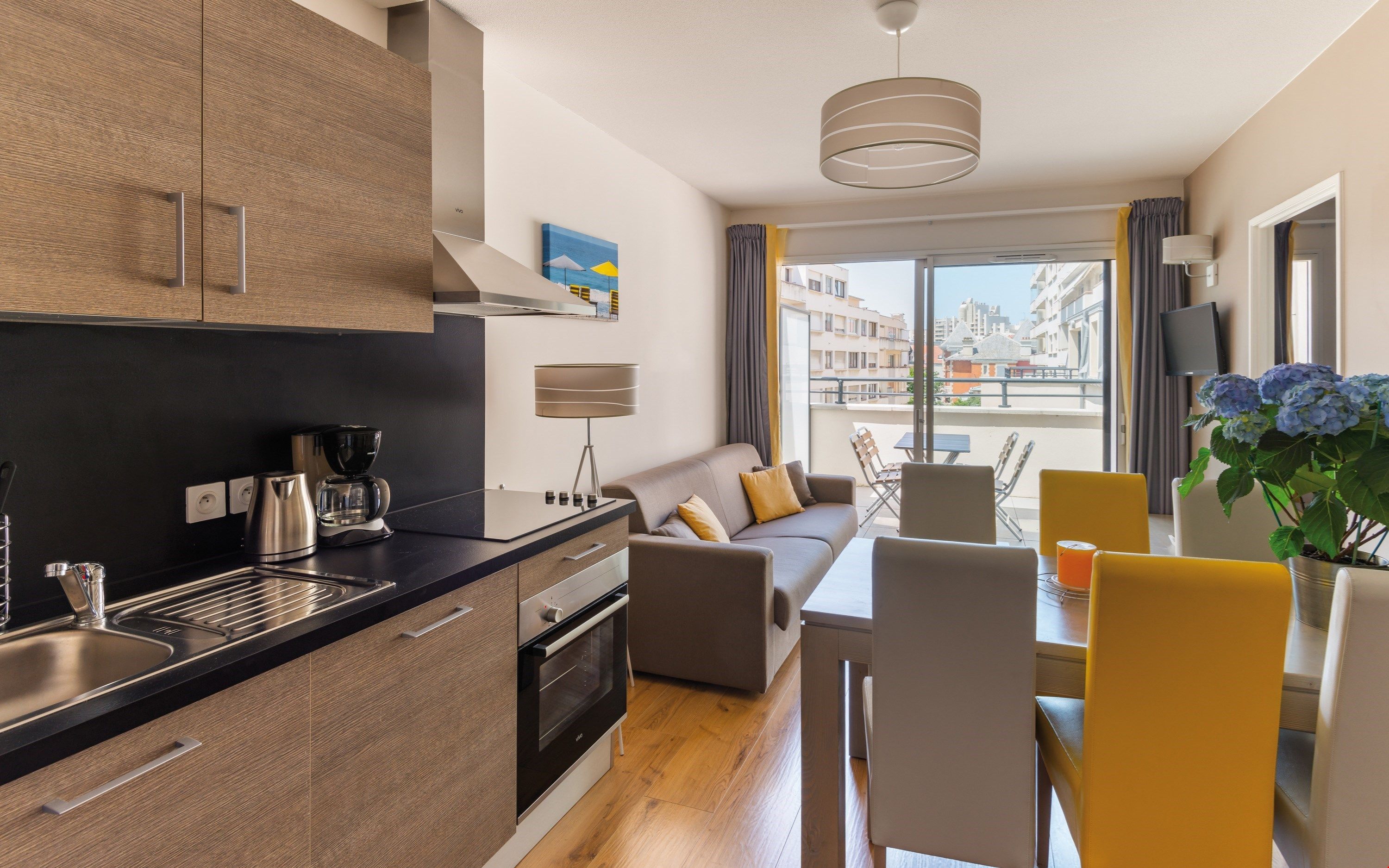 image Prepare meals in the kitchenette and enjoy them at the dining table - Some units MAY have a balcony. Please let us know if you would like a unit with a balcony or a patio and we will do our best to accommodate you.
