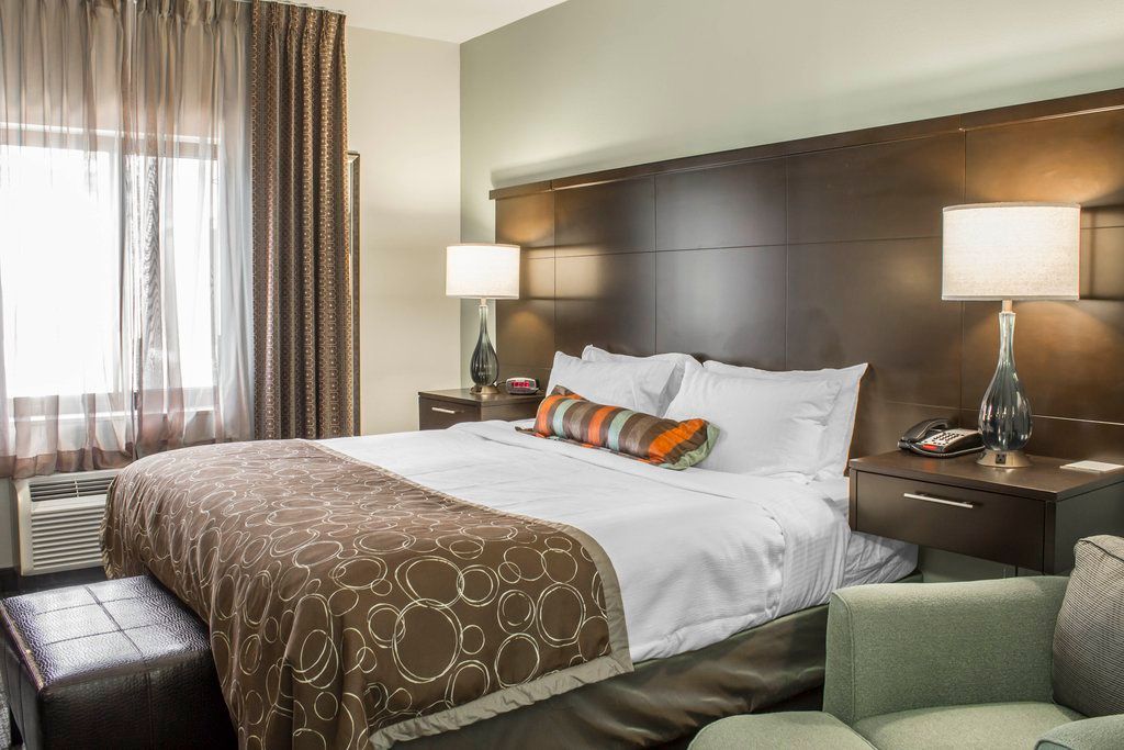 image Bright and airy, the spacious bedroom offers a plush bed and a comfortable seating area for your quiet moments.