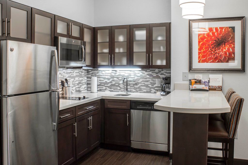 image Prepare meals with ease in this modern kitchen, featuring sleek cabinets and stainless steel appliances that blend style with functionality.