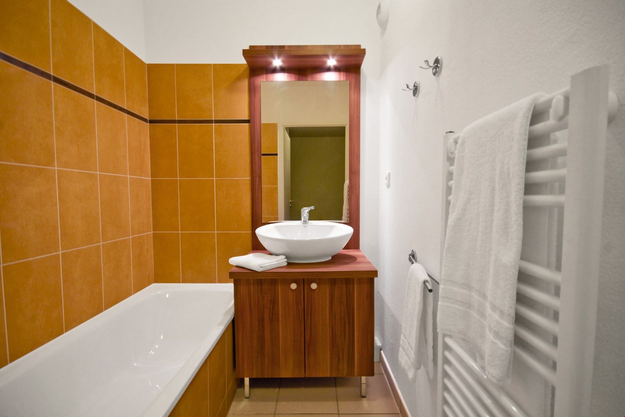 image Get ready for the day in the bright and spacious bathroom.