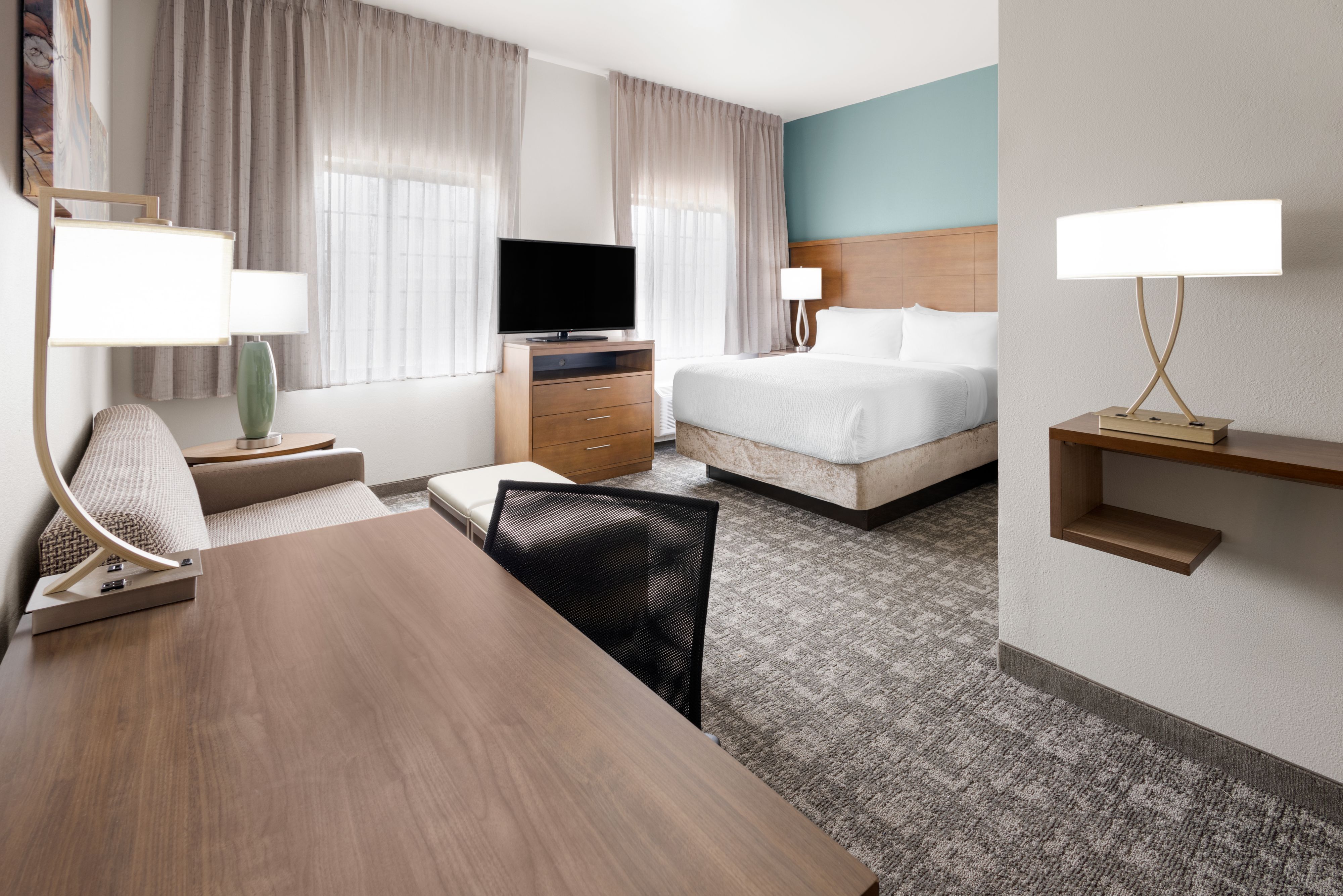 image Well-appointed studio suite with a comfortable king bed and relaxing seating area.