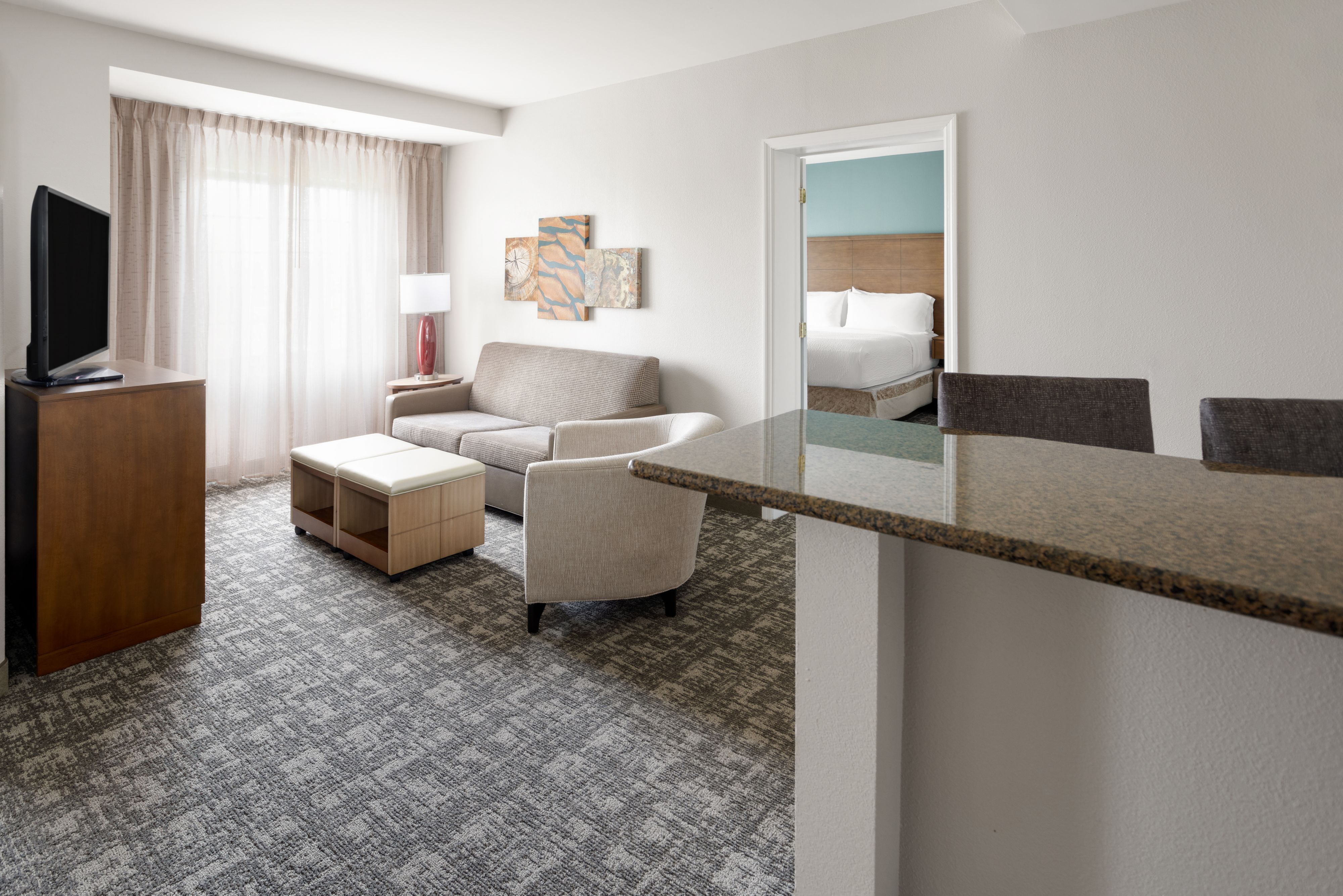 image Inviting living space with a cozy sofa and comfortable armchair.