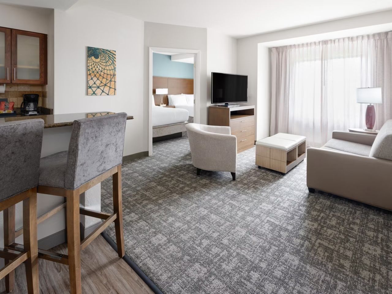image Gather in the spacious living area with a flat-screen TV and plush seating — wind down after a day at Hersheypark