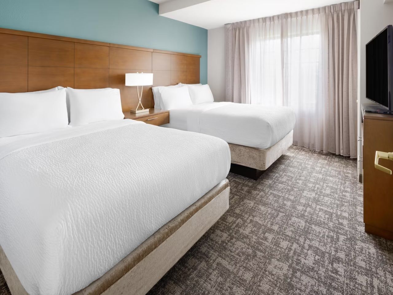 image Second bedroom with two double beds and a closet — plenty of room for the whole family