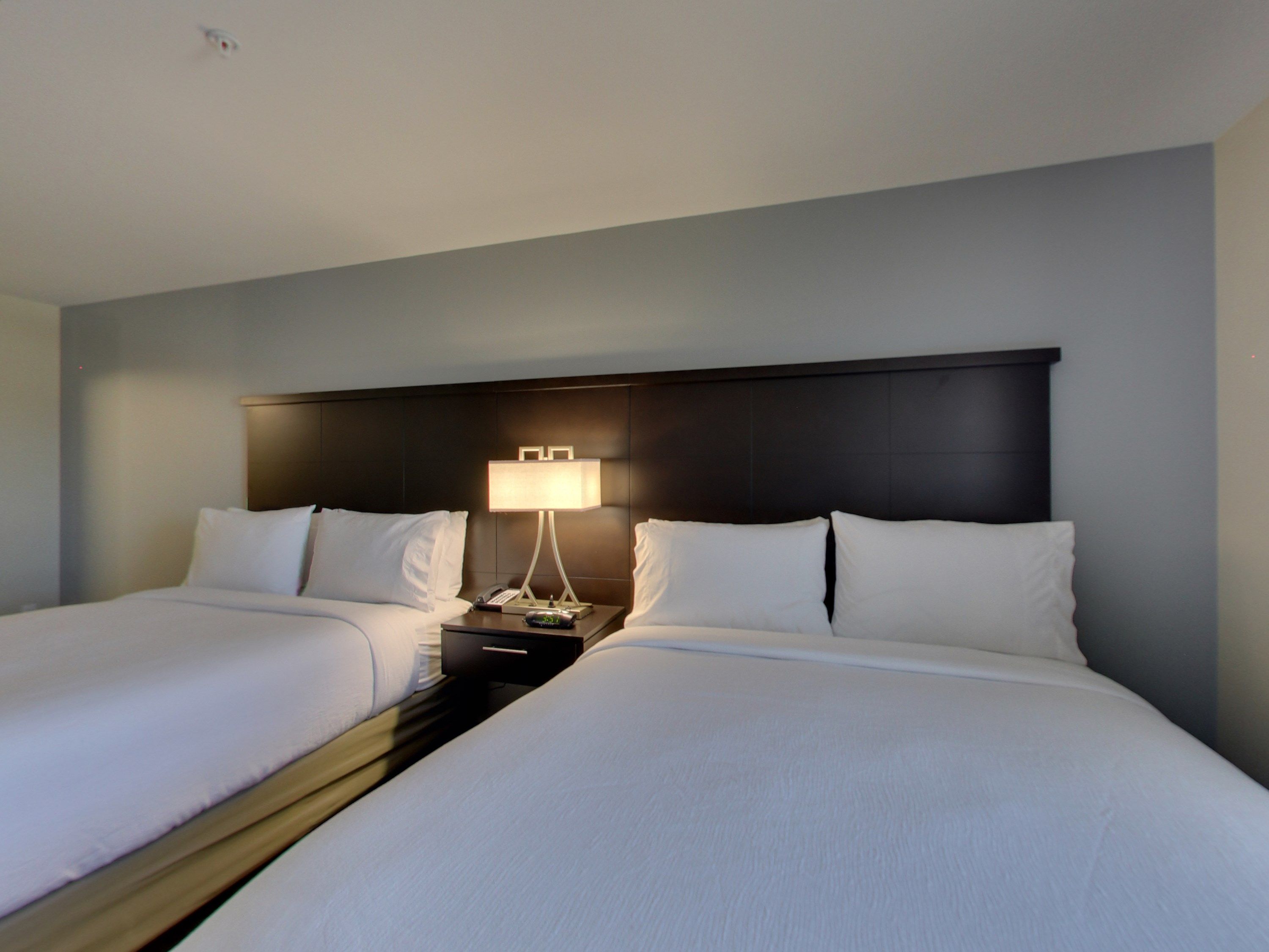 image Drift to sleep in a comfortable bed after a busy day.