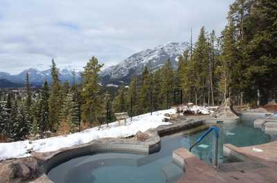 Immerse yourself in a peaceful mountain escape, where warm waters and breathtaking alpine views create the perfect retreat.