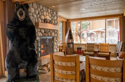 Relax in the resort lounge, where rustic decor and a crackling fireplace create a warm and inviting atmosphere.