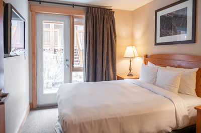 This queen bed is the perfect place to unwind.