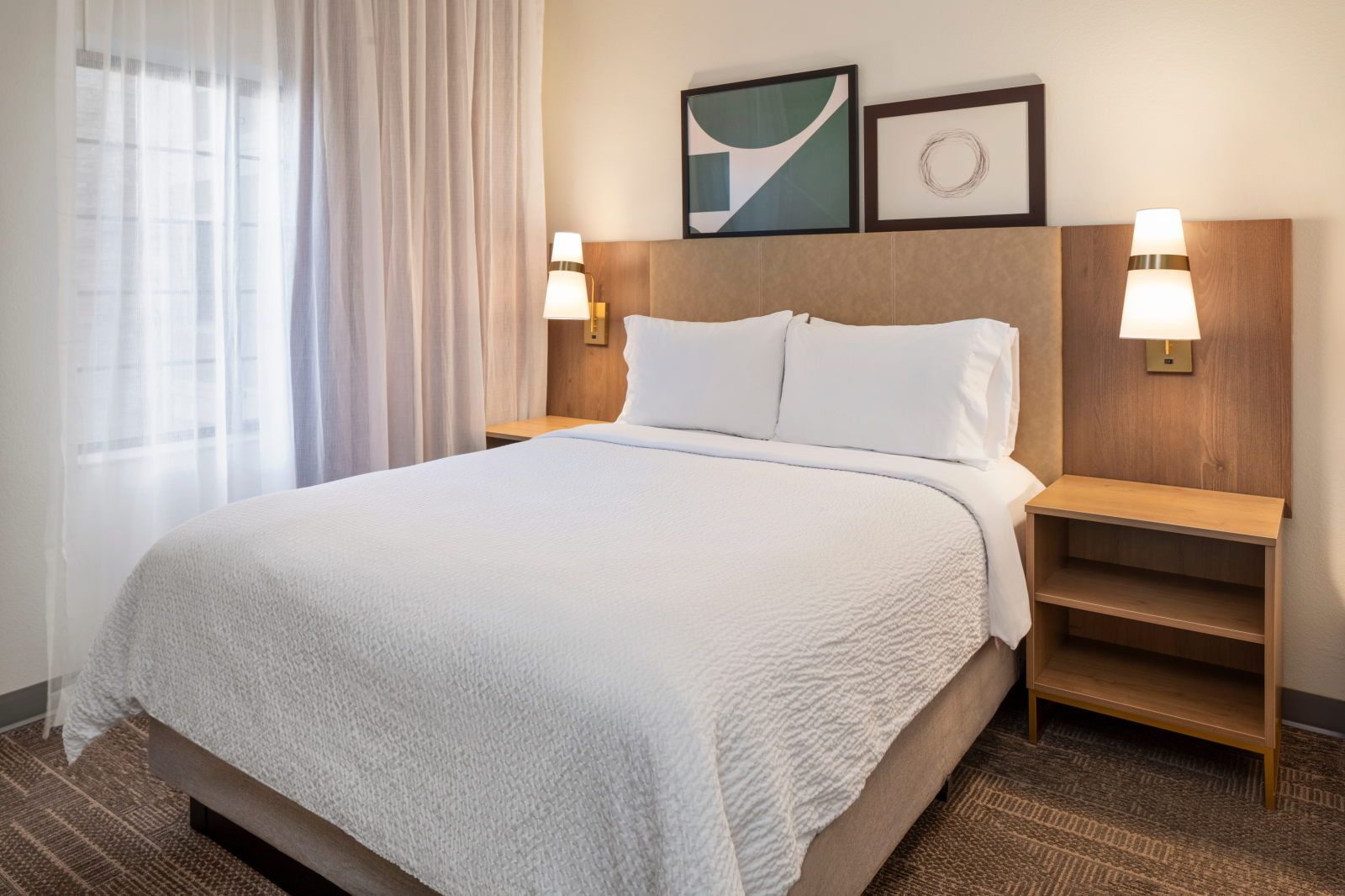 image Queen bedroom with flat-screen TV — a quiet retreat at day's end