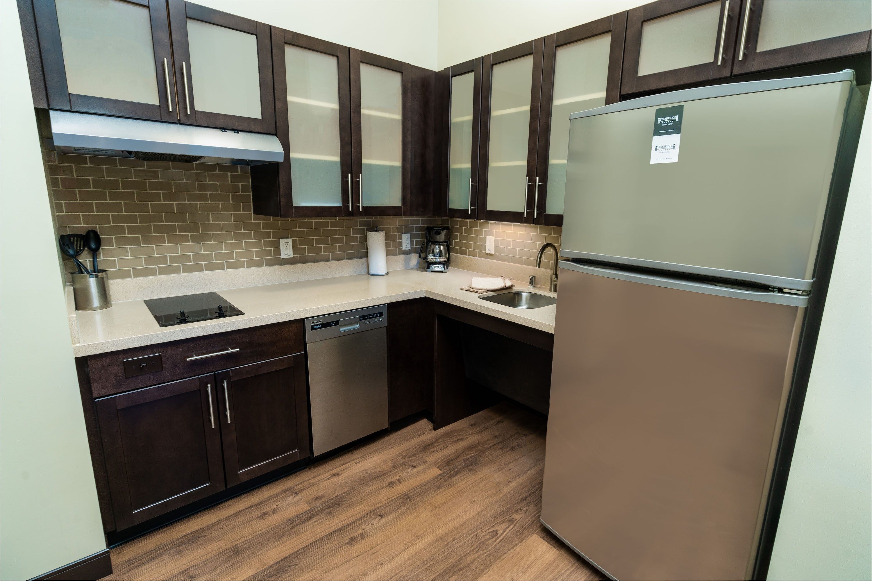 image Kitchen featuring dark cabinets, stainless steel appliances, and a countertop.