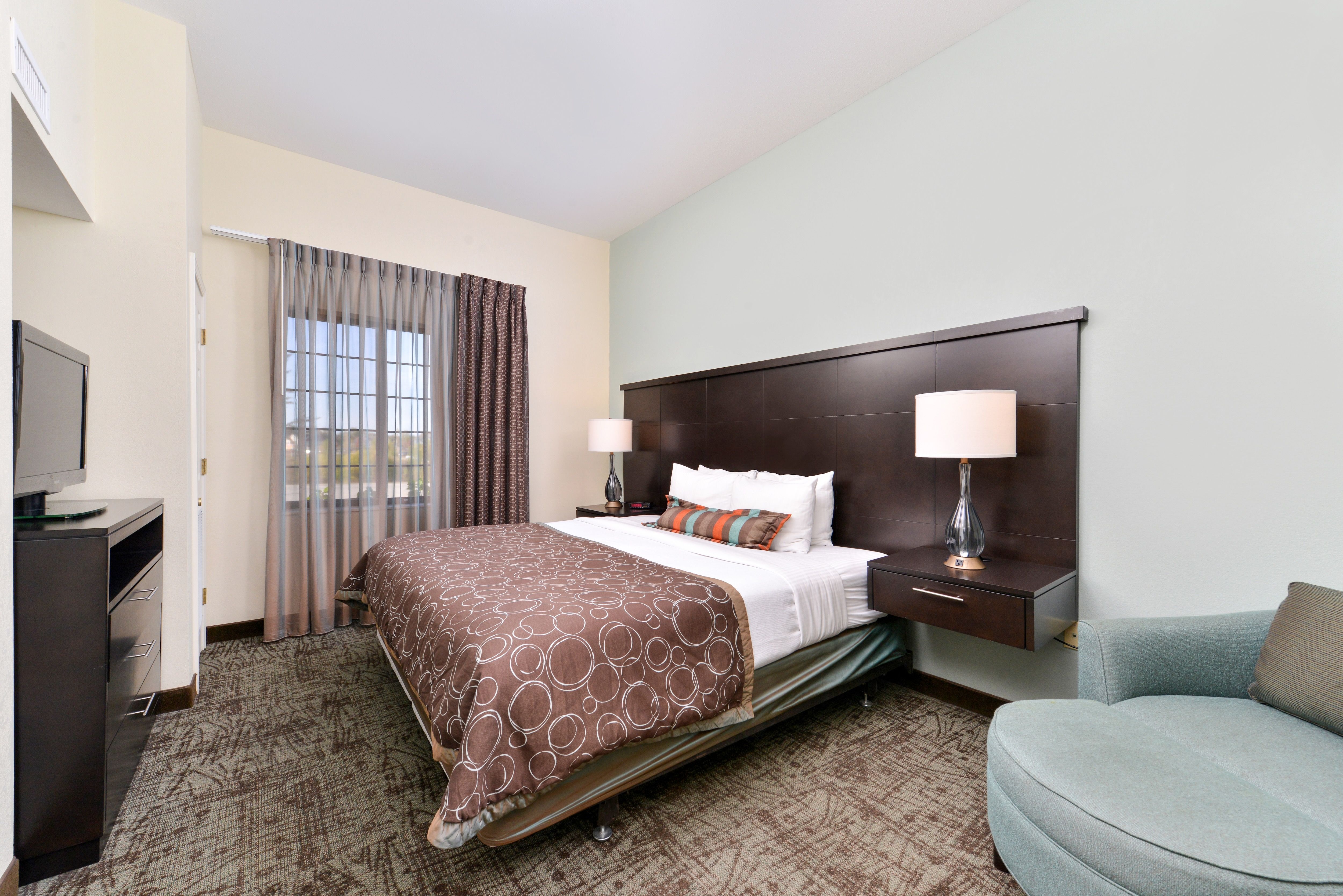 image Bedroom with a large bed and bedside tables