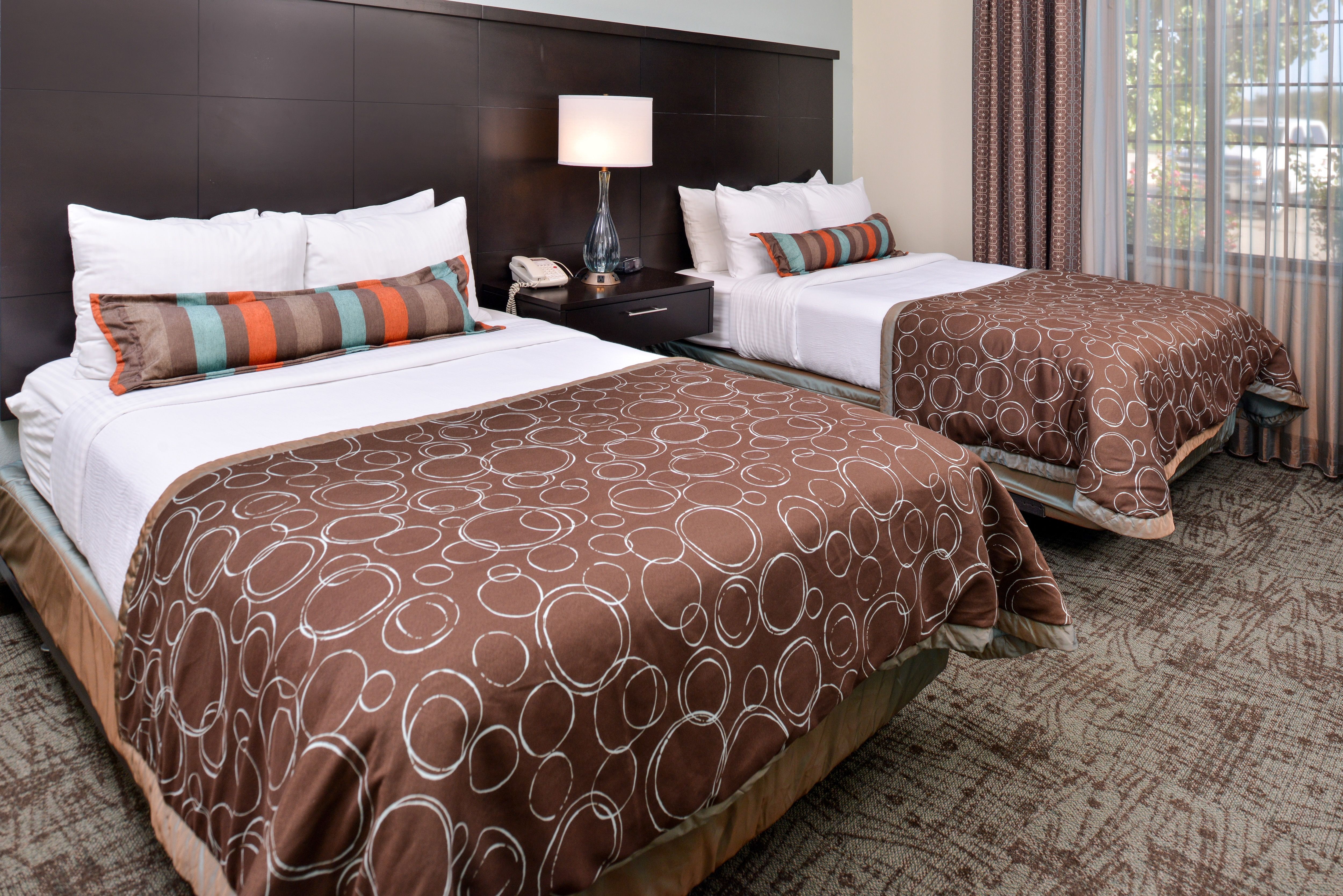 image Bedroom with two beds and seating