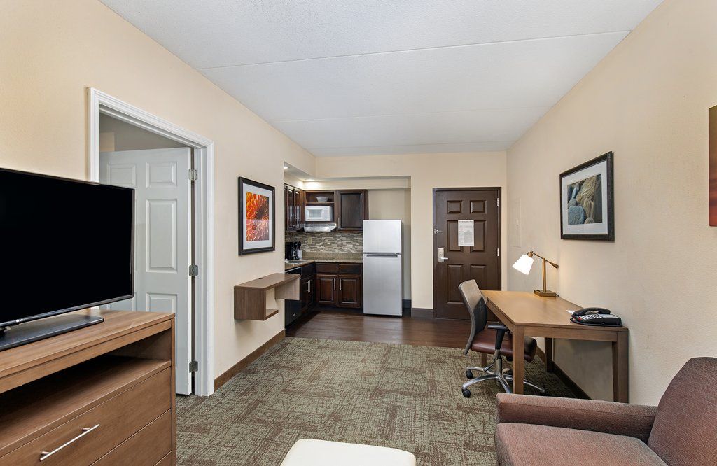 image Experience comfort and functionality with a well-equipped kitchen and a comfortable workspace, ideal for both leisure and business travelers.