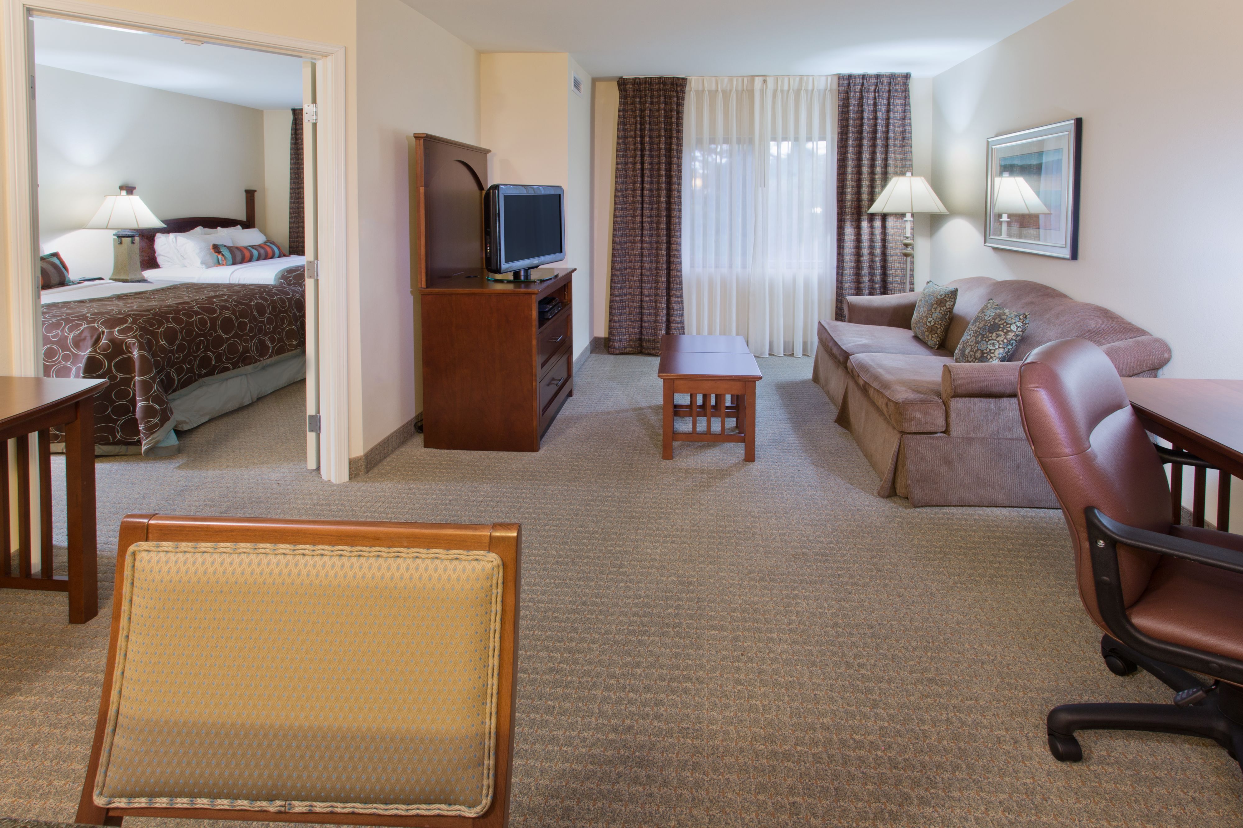 image Inviting seating area with a view into the bedroom.