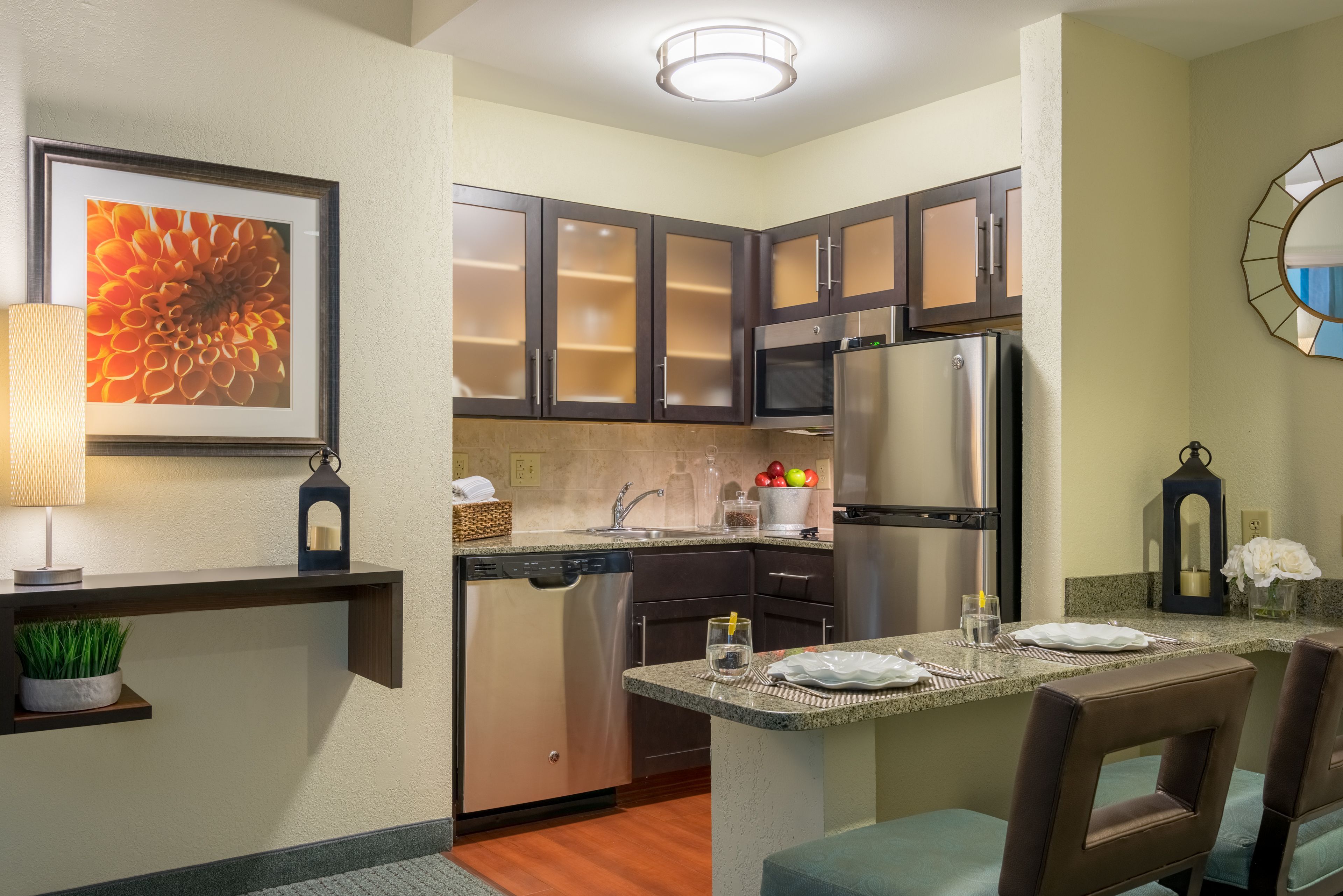image Kitchen with dark cabinetry, stainless steel appliances, and full cooking essentials.