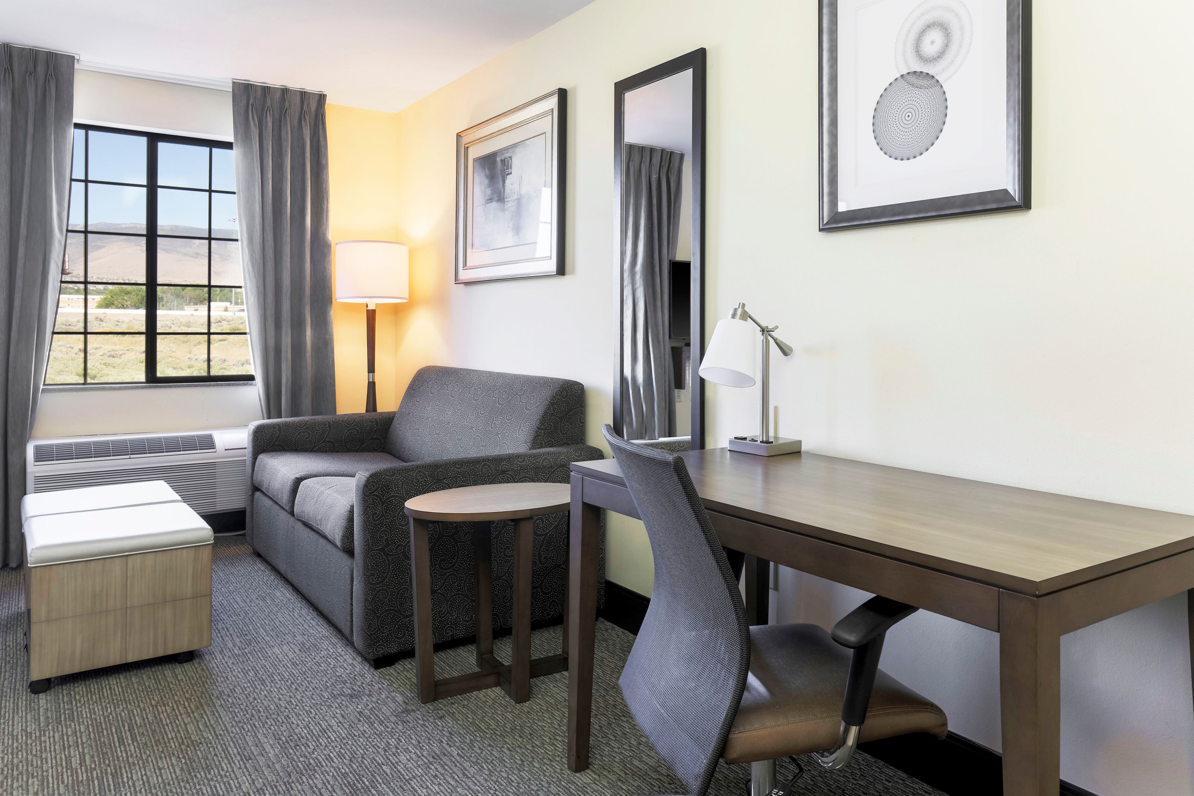 image Unwind or get things done in the sitting area with a sofa and work desk.