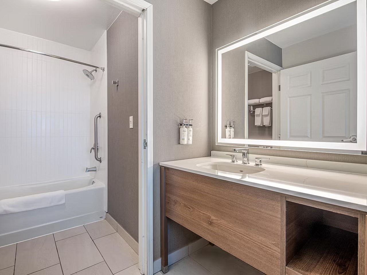 image Refresh in the modern bathroom, complete with a sleek vanity and convenient shower/tub combo.