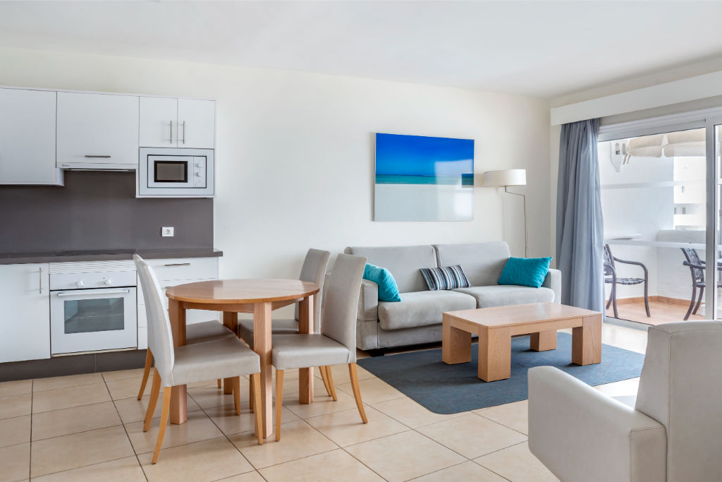 image Bright and airy living room with comfortable seating, merging effortlessly into the dining area for an open-concept feel.