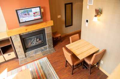 Sit back in this beautiful living area featuring warm decor and a beautiful fireplace.