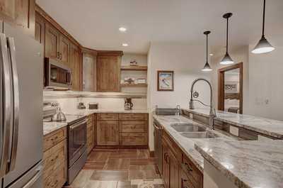 Prepare a meal in the kitchen.