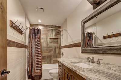 Get ready for the day in the modern and bright bathroom.