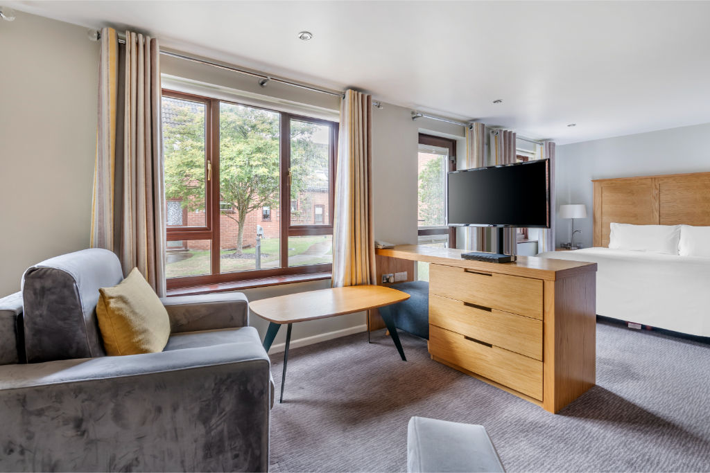 image Relax in this cozy living room with stylish comfort and a view.