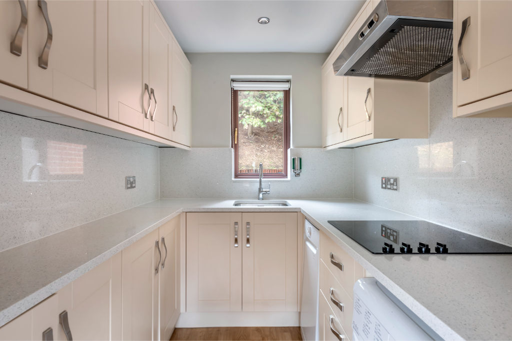 image Sleek kitchenette perfect for preparing simple meals and snacks.