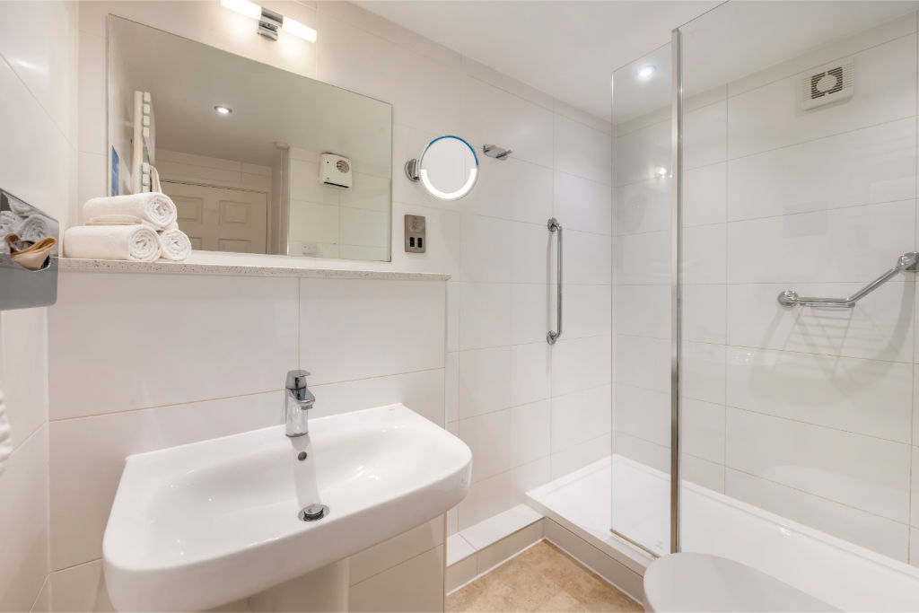 image Sleek and modern bathroom with high-quality finishes for your convenience.