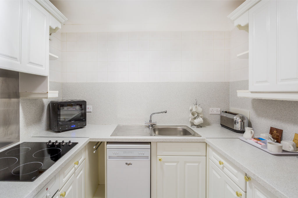 image Compact yet fully-equipped kitchen to inspire your culinary creations