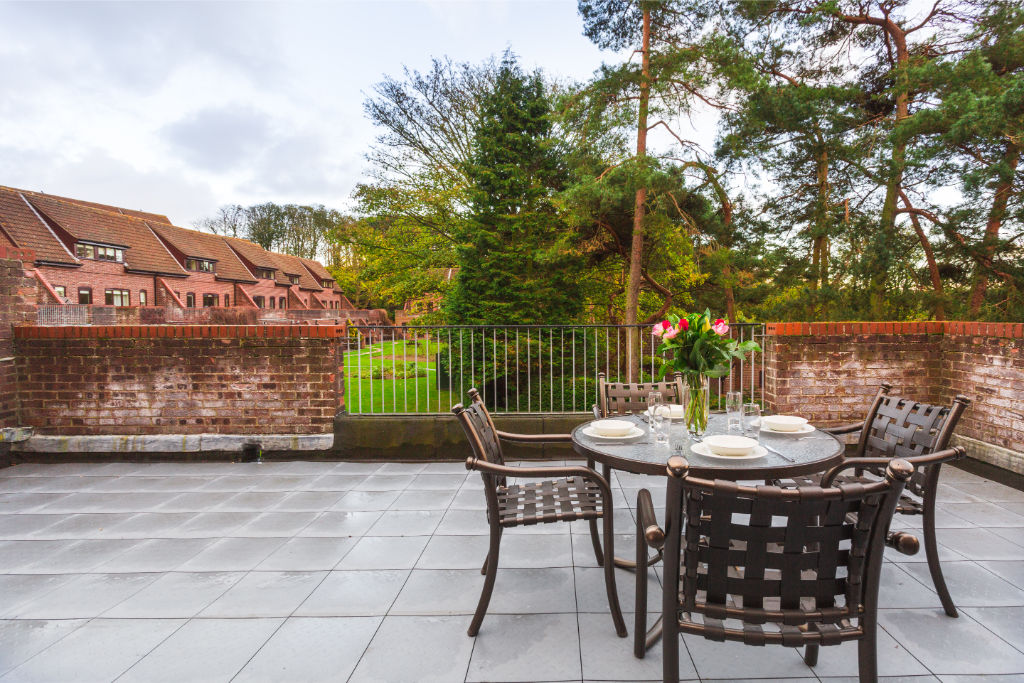 image Rooftop terrace with dining set to enjoy meals under the open sky.