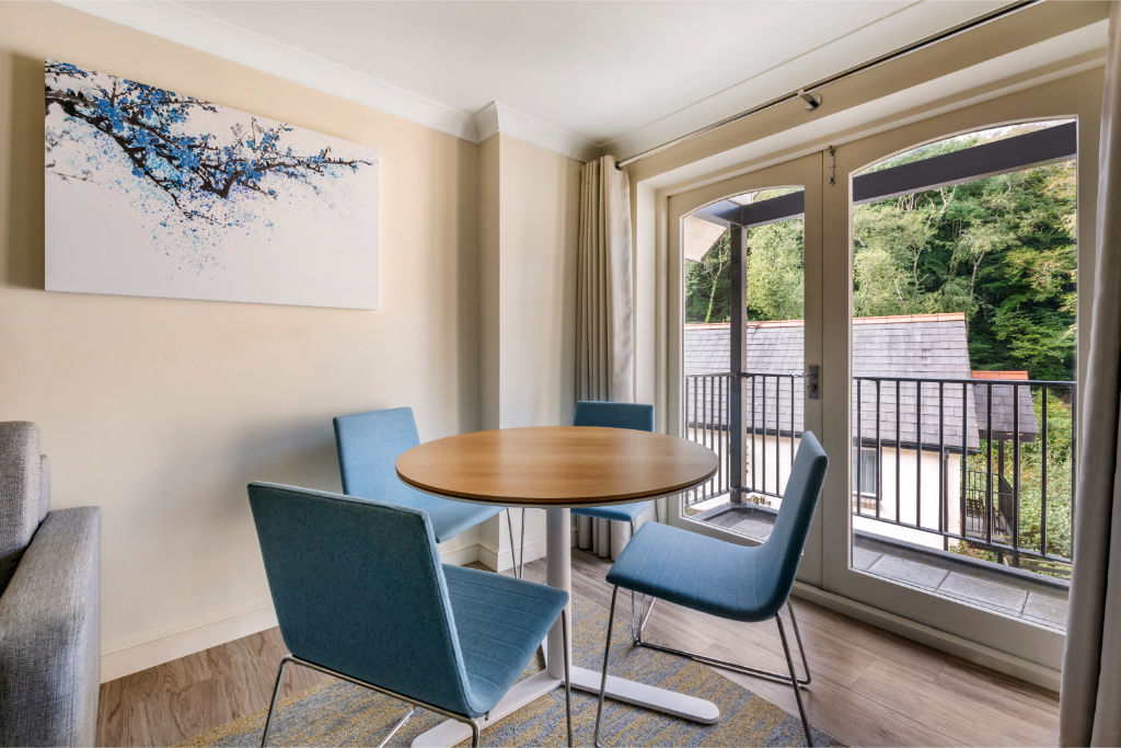 image A bright dining area with outdoor access, providing a pleasant space for meals and gatherings.