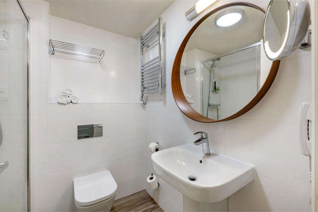 image A neatly presented bathroom with modern fixtures.
