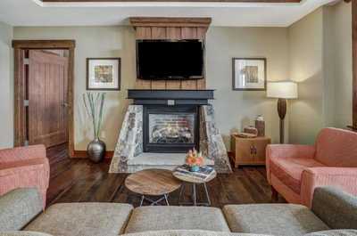 Take a seat in front of the fireplace and enjoy a movie in the living area.