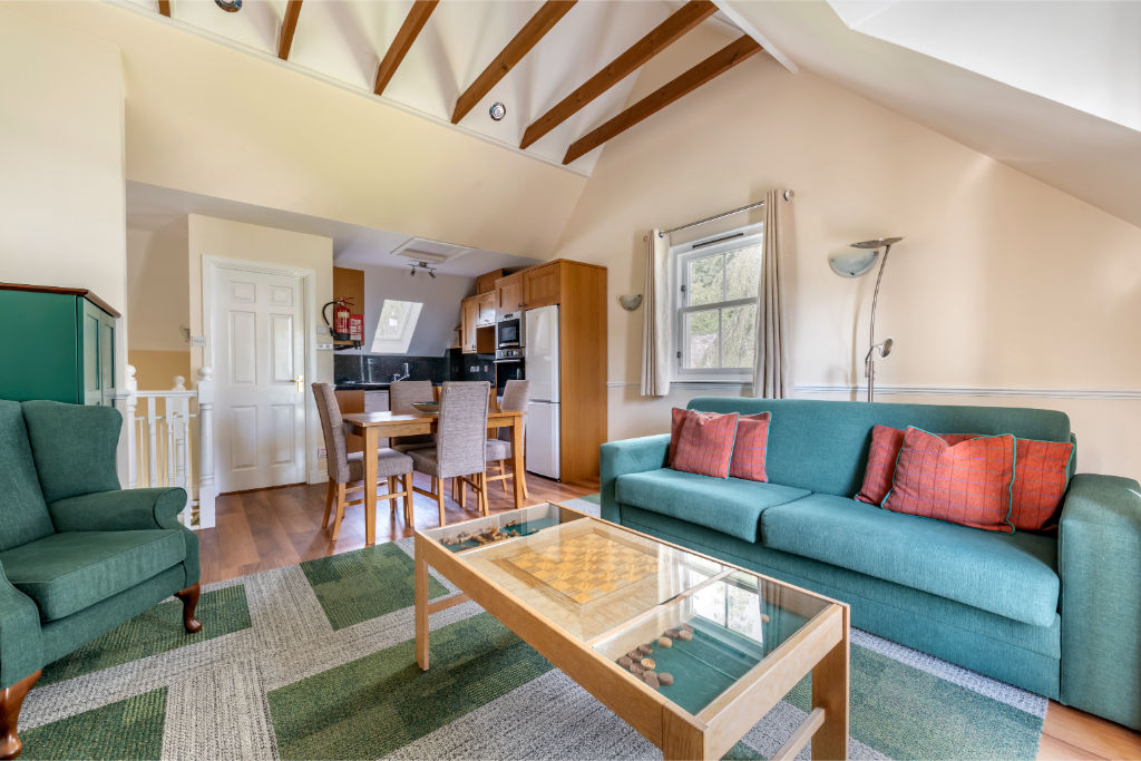 image Welcoming living room with plush seating and rustic charm.