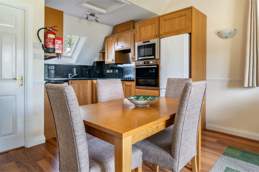 image Dining area set for comfort and conversation, nestled within a warm ambiance.