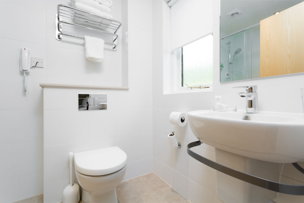image A modern and streamlined bathroom, designed for ease and simplicity.