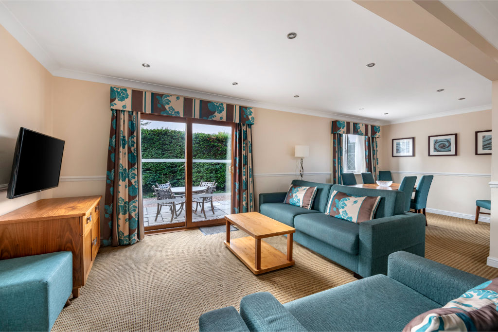 image A welcoming open-plan living space with plush seating and a homely feel.