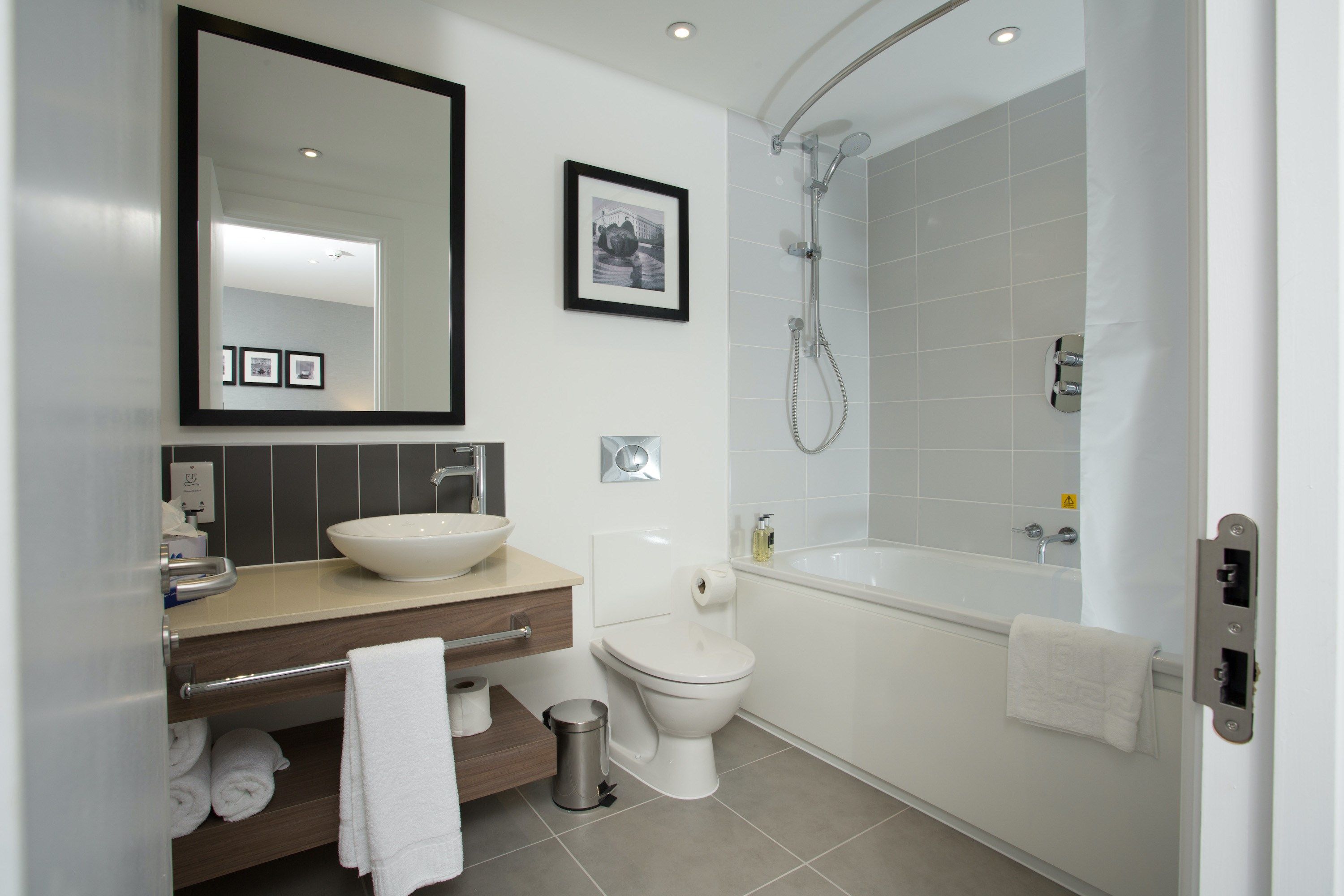 image Get ready for your day in the lovely bathroom - Please note the bathroom may feature a shower or a bathtub.