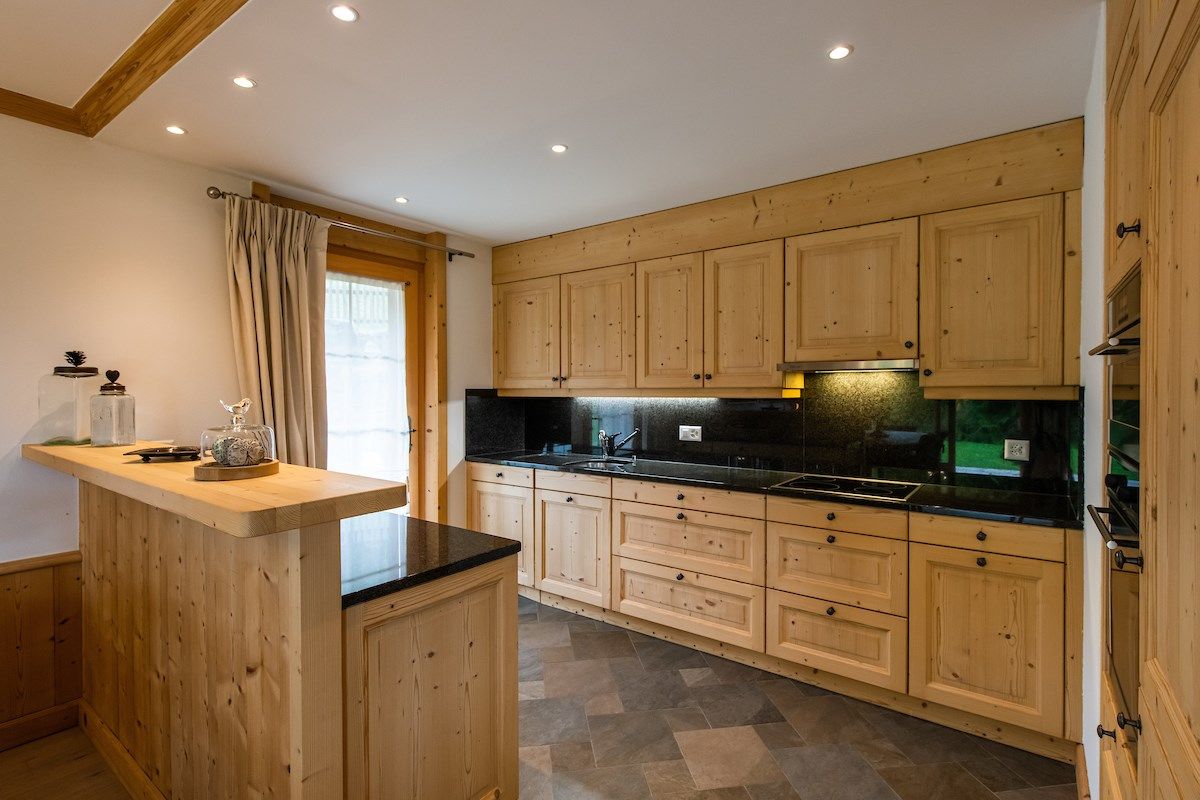 image Curb your appetite by cooking a meal in your kitchen.