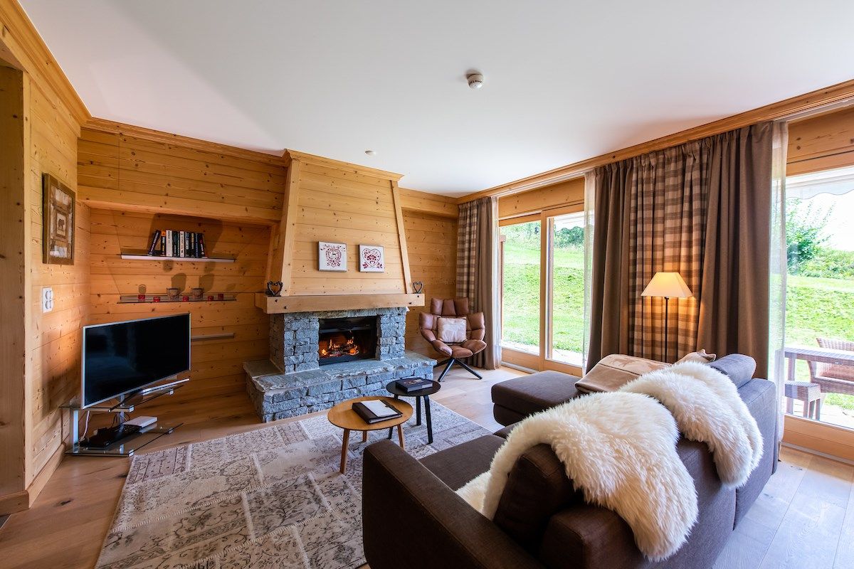 image Take a seat in front of the fireplace and enjoy a movie in the living area.